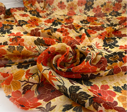 Chiffon met lurex - oranje/rood bedrukt